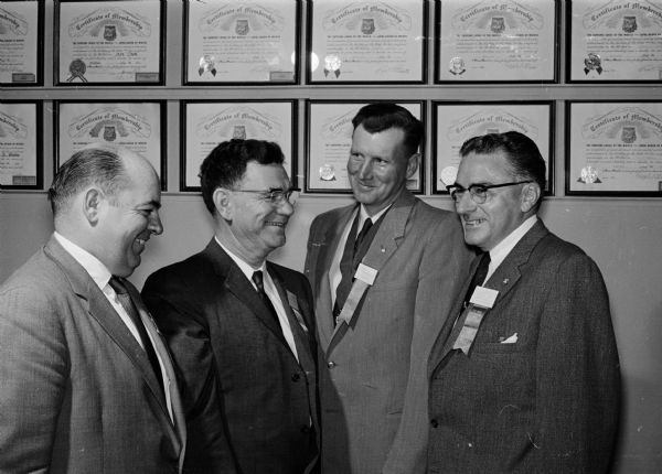 Wisconsin Moose Association Convention Four Moose Association officers pose for a group portrait at the spring convention of the Wisconsin Moose Association. Left to right are: Joseph L. Ward, Cudahy, state president; Clayton J. Crooks, Wausau, supreme prelate; John Kannenberg, Wausau, deputy supreme governor; and Earle Horton, Mooseheart, Illinois, national director of membership conservation.