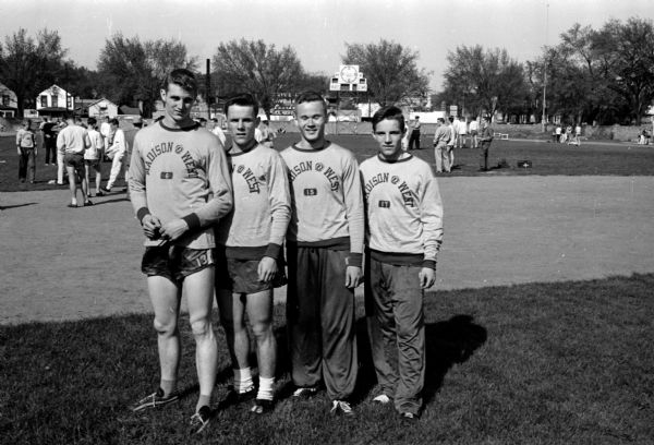 West High School's sprint medley team won in the city track meet. The quartet, left to right, includes: Jim Broadbent, Dave Marsh, Ken Brigham, and Russ Rasman.