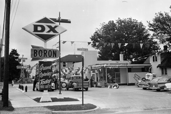 Exterior view of Ripp's DX service station, 2101 North Sherman Avenue in Madison. To the right of the station is a house at 1710 Winchester.