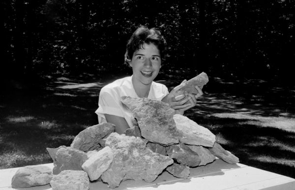 Nancy Muckenhirn is shown with Devil's Lake rocks that the Black Hawk Council of Girl Scouts will be taking to Colorado Springs for the Senior Girl Scout Round-Up.