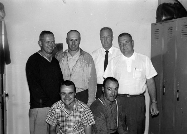 Portrait of the leaders of the Madison men's city golf tournament after the first four rounds. The men qualified for the final two rounds; they include (left to right) front row, Jack Allen, and Steve Caravello; back row, Harry Simonson, Al Mickelson, Bill Garrott, and Fred Gage.