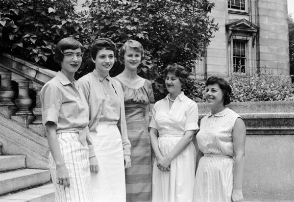 Mrs. Mary Jane Stark and Mrs. Margaret Stehr, officers of the Madison Alumnar Panhellenic Association, are shown with three 1959 high school graduates that are scholarship recipients from the Association. They are Arlys Watkins of Madison West, Marilyn Dvorak of Madison East, and Kay Van Dyke of Madison Central.