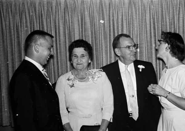 Dr. Lester McGary (shown second from right), pathologist emeritus at Madison General hospital, is honored for his 36 years of service starting in 1923. Shown from left to right are: Alfred Grube, the only male technician trained by McGary; Mrs. McGary; Dr. McGary; and Florence Griswold, a hospital technician for 15 years.