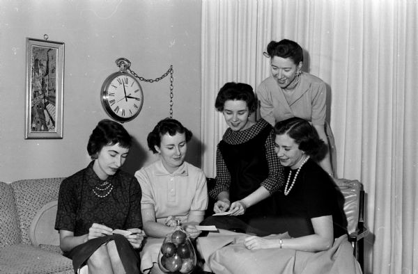 IBM Women's Club Committee members make plans for the IBM Women's club Christmas dinner-dance. Left to right: Patricia Pfeffer, Marie Mesarchik, Teresa Coghlan, Mrs. R.B. Coffelt, and JoAnn Vosacek.