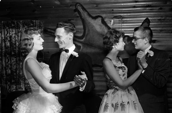 Epsilon Sigma Alpha Benefit Dance Two sisters and their dates dancing at the Epsilon Sigma Alpha benefit dance. They are, left to right: Carole Klubertanz, Vito Gervasi, Carole Klubertanz and Dave Evans. The event raised funds for the new Wisconsin Central Colony, an institution for mentally disabled children.