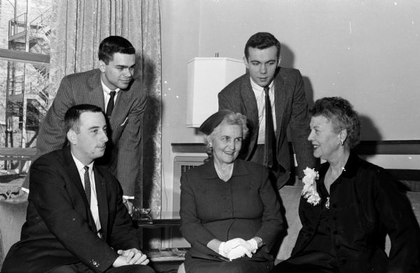 We Saw You . . . at Alpha Delta Phi Reception An open house for representatives of University of Wisconsin campus groups, housemothers, and alumni is held at the new Alpha Delta Phi fraternity house. Shown seated (L-R) are: Gary Mayhew, Plymouth, WI, Alpha Delta Phi treasurer; Mrs. W.S. Slemmons, Alphi Chi Omega housemother; and Mrs. Eugene Shaw Sullivan, Alpha Delta Phi housemother. Shown standing (L-R) are Kurth Krause, Milwaukee WI, Alpha Delta Phi vice-president; and Allen Ten Broek, Elm Grove, WI, Alpha Delta Phi secretary.