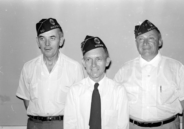 Legion Post Commanders Group portrait of three members of American Legion Post 501 who are active commanders. They include, left to right: Robert Wold, Dane County commander; Harold Berge, post commander; and Norman Muth, soon to be installed Third District commander.