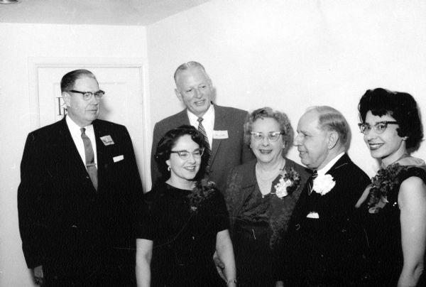 Layman W. Fleming, second from right, retired after 18 years as district manager of the Western Union Telegraph Co., and after 42 years in the telegraph business. Left to Right: Nina Fleming, a daughter; Louise Fleming, G.P. Little, general manager of the Lakes division of the telegraph firm.