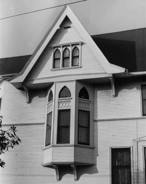 Oriel and Gothic Windows An oriel window below three small Gothic style windows on a house at 1150 Spaight Street.