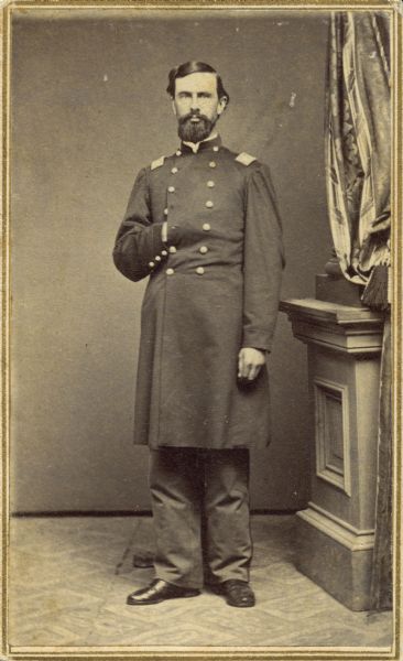 Standing portrait of Edward M. Bartlett, lieutenant colonel of the 30th Wisconsin, taken during the regiment's assignment at Camp Randall, 1862-1864.