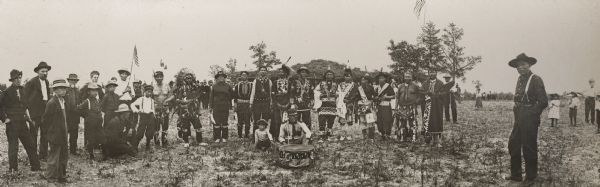 This photograph of Ho-Chunk powwow participants is a copy made by Van Schaick. From left to right are: John Hazen Hill (HaNaKah), William Hall (HunkKah), William Hinsley (Hensley), John Highsnake (HaukSheNeeKah), Thomas Thunder (HoonkHaGaKah), Chief  George Winneshiek (NauConChawNeeKah), George Greengrass (WauKeCooPeRayHeKah), John Davis (KaRoJoSepSkaKah), Luke (Duke) Snowball (NySaGaShiskKah), George Lonetree (HoonchXeDaKah), Henry Greencrow (CooNooZeeKah), William Hanson(HoonchHoNONikKah), David Goodvillage (WauHeTonChoEKah), George Monegar (EwaOnaGinKah), and Frank Winneshiek (WaConChaHoNoKah).