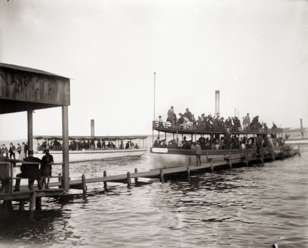 Two steamboats docked at Lake Monona. Boat in foreground is identified as "Lake Side". A third boat is in the background.