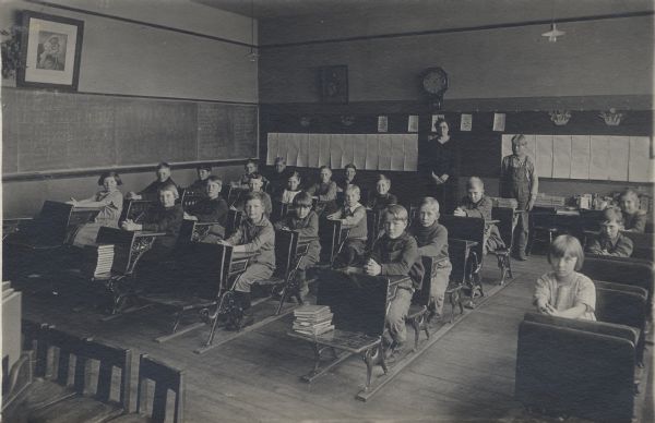 Clear Lake School Classroom Students seated in a classroom in the Clear Lake School. Gaylord Nelson, later governor of Wisconsin and a United States senator, is seated at the front of the third row from the left.