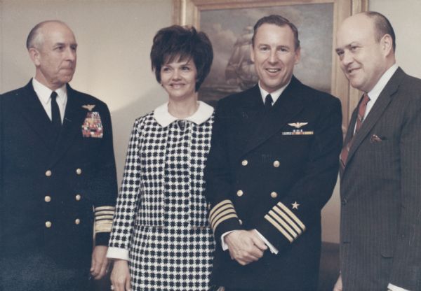 Secretary of Defense Melvin Laird of Wisconsin (on the far right) with astronaut James Lovell, a former student at the University of Wisconsin, and his wife Marilyn Gerlach Lovell of Milwaukee at the ceremony at which Lovell received the Navy Distinguished Service Medal. The medal was presented after the Apollo 8 flight. With them is Admiral Thomas Moorer, later chairman of the joint chiefs.