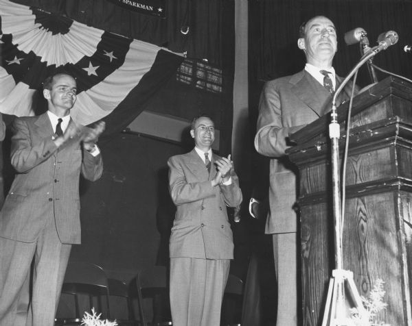 Democratic Presidential Candidate Adlai Stevenson speaking to an audience.  On the platform with him are William Proxmire, who was making the first of his three unsuccessful campaigns for governor, and Thomas Fairchild, who was running for Joseph R. McCarthy's seat in the Senate.