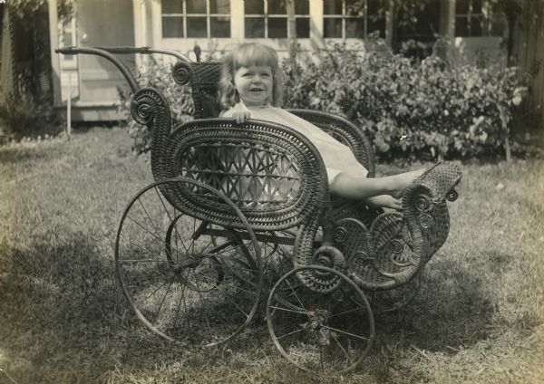 Agnes Moorehead Agnes Moorehead is shown at about 4 years of age sitting in a handsome wicker baby carriage outdoors.