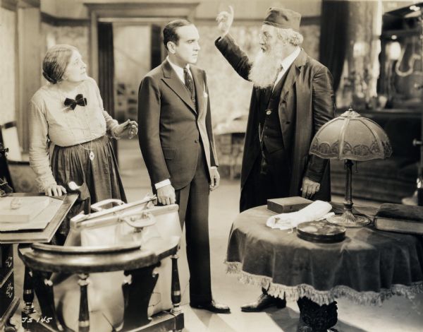 A still from the film <i>The Jazz Singer</i> showing Eugenie Besserer, Al Jolson, and Warner Oland (Warner 1927).