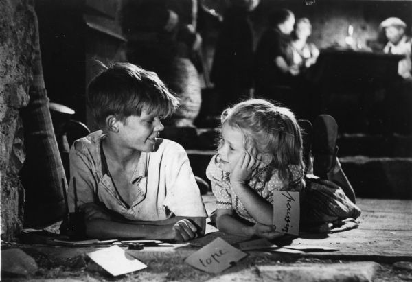 George Poujouly and Nathalie Pascaud in <i>Jeux interdits (Forbidden Games)</i> Scene still of George Poujouly as Michel and Brigitte Fossey as Paulette in René Clément's <i>Jeux interdits (Forbidden Games,</i> 1952).