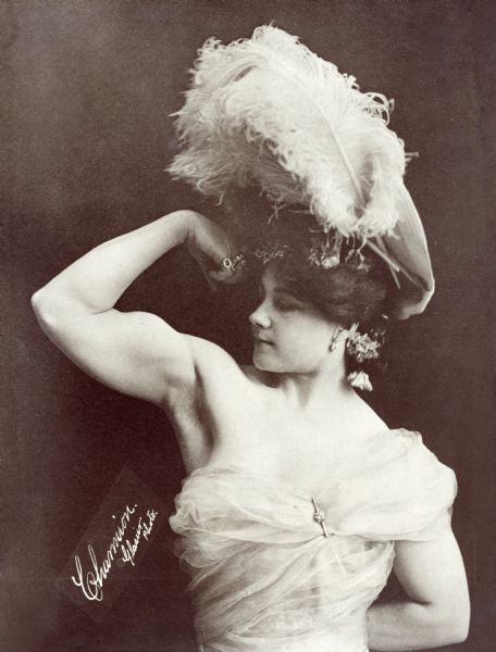 Charmion (1875-1949, born Laverie Cooper in Sacramento) was a vaudeville trapeze artist and strongwoman who performed a trapeze striptease in 1897 that made her famous. Her performance was recorded in an Edison Company silent film "Trapeze Disrobing Act" in 1901.

<i>New York Times,</i> 12 December 1897:
"Laveria Charmion, a female trapese performer, who will appear at Koster & Bial's this week, appears on the stage and ascends to her bar in midair in what seems to be street costume. While on the bar she gradually discards her superfluous apparel. This is accounted a 'sensational' turn."