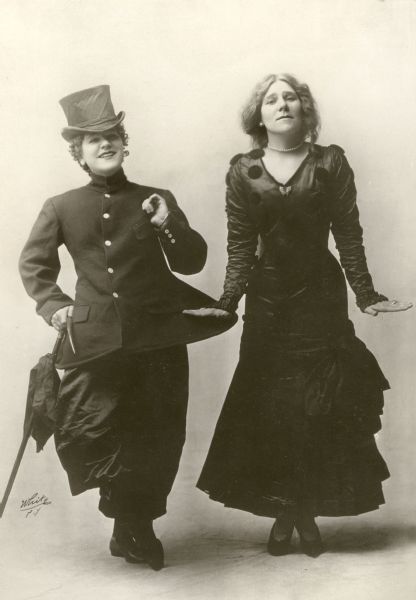 Mazie Trumbull, famous as a cross-dresser and dancer, and her sister Frances, side by side in a White Studio photograph.