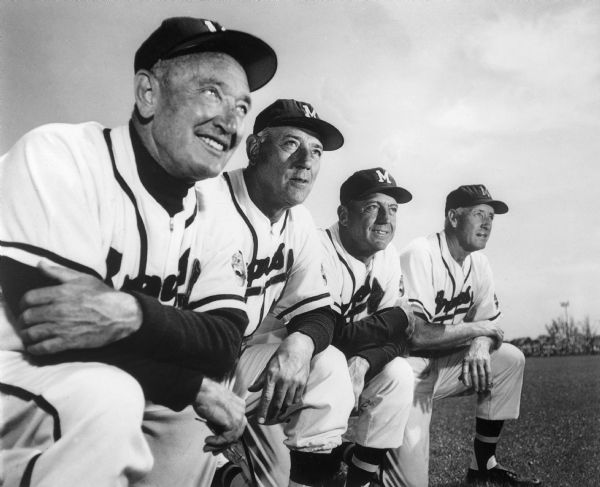 Fred Haney (left), manager of the Milwaukee Braves baseball team with coaches.