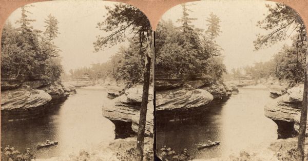 Stereograph looking down the river through The Narrows. A man rowing a small boat is visible.