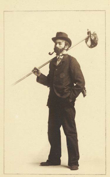 Albert Hansen, member of the Menomonie High School class of 1905, depicting himself as a hobo, with a pipe and a handkerchief. Part of a yearbook he created, based on a class prophecy theme.