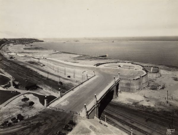 Lincoln Memorial Drive Elevated view of Lincoln Memorial Drive at the point where it joins Wisconsin Avenue, now the site of the Milwaukee County War Memorial Center. Lake Michigan is in the background, and below the road are railroad tracks.
