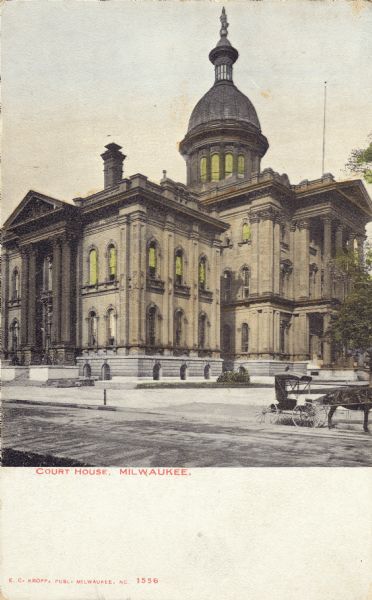 View of the courthouse taken from across the street. A horse and carriage is parked along the curb on the right. Caption reads: "Court House, Milwaukee."