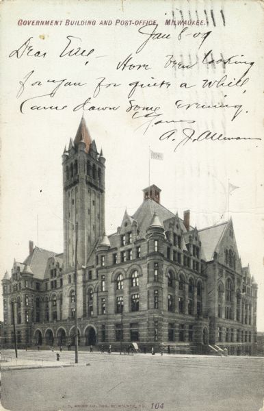 Building with tower from street level. Two flags fly are on top of the building. Caption reads: "Government Building and Post Office, Milwaukee."