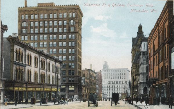 Wisconsin street looking west, with the Gimbels sign on the building in the background. Text on postcard reads: "Wisconsin St. & Railway Exchange Bldg., Milwaukee, Wis."
