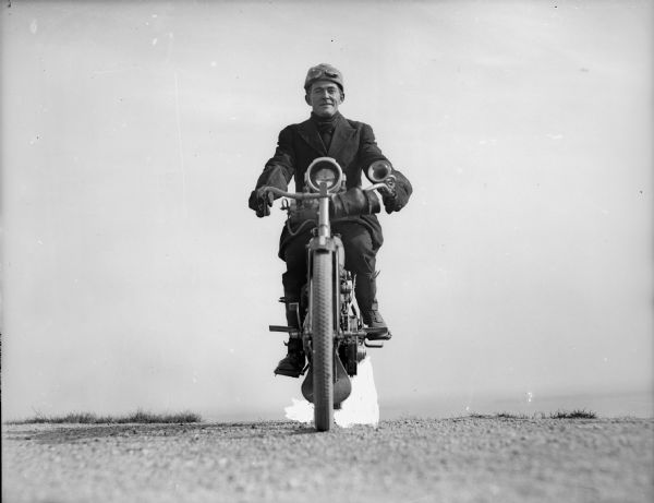 Front view of the photographer J. Robert Taylor on his motorcycle.