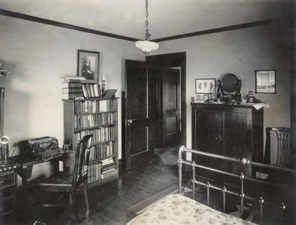 Richard Lloyd Jones's bedroom, 1010 Walker Court (now known as Rutledge Court).  His Underwood typewriter, telephone, and bookcase are seen.  Lloyd Jones was editor of the Wisconsin State Journal from 1911-1919.