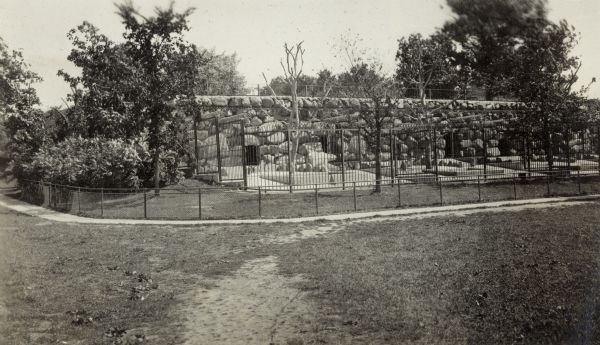 Bear pits at Henry Vilas Zoo (Vilas Park Zoo), opened in 1911, with a polar bear in the nearest display area.