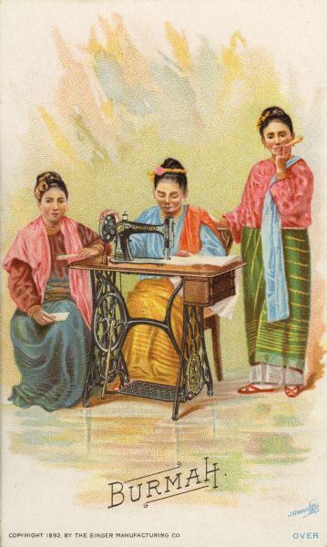 Chromolithograph card of a group of three women from Burmah in "native" Burmese costume, posing next to a Singer sewing machine. Part of a "Costumes of All Nations," set created as a souvenir at the 1893 World's Columbian Exposition.
