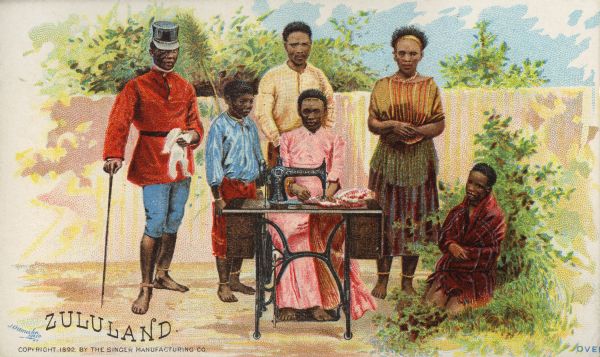 Chromolithograph card of a group of people from "Zululand" in "native" costume, posing next to a Singer sewing machine. Part of a "Costumes of All Nations," set created as a souvenir at the 1893 World's Columbian Exposition.