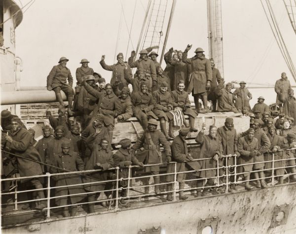 Members of the 15th Regiment (Colored) of the New York National Guard arrive home as heroes. They earned the distinction of being the only regiment to never have a man captured or lose a foot of ground or trench.