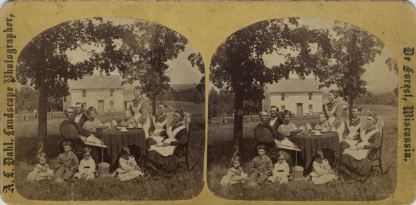 Stereograph of Rev. A. Jacobson, family and visitors, Perry, Wis." from Dahl's 1877 "Catalogue of Stereoscopic Views." Jacobson (1836-1910) immigrated to the United States in 1848. He married Nicoline Hegg in 1863.