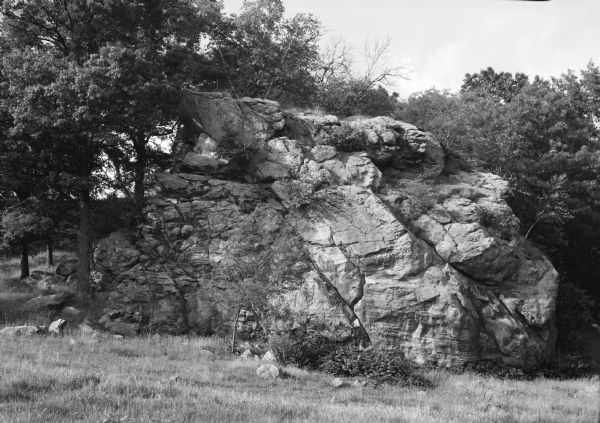 A large rock outcropping in a pasture of iron-bearing rock.
