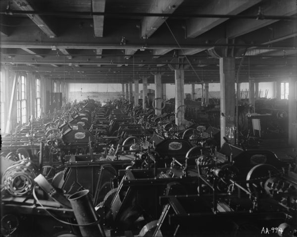 Little Giant husker-shredders arranged in rows inside a warehouse at the McCormick Works.