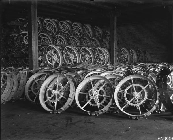 Stacks of implement wheels in a factory storage room, most likely at the McCormick Reaper Works.