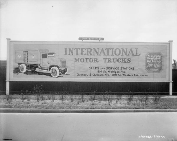 International Harvester Motor Truck Billboard View from across road towards a Motor Truck billboard.