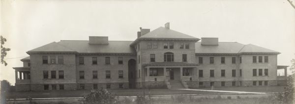 Exterior view of front of a Winnebago County Asylum building.