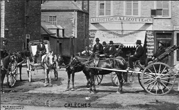 Horse-Drawn Carriages Men pose in their horse-drawn carriages. Behind them, store awnings advertise products. Titled "Calêches," which is the term for the folding hood of a horse-drawn carriage.