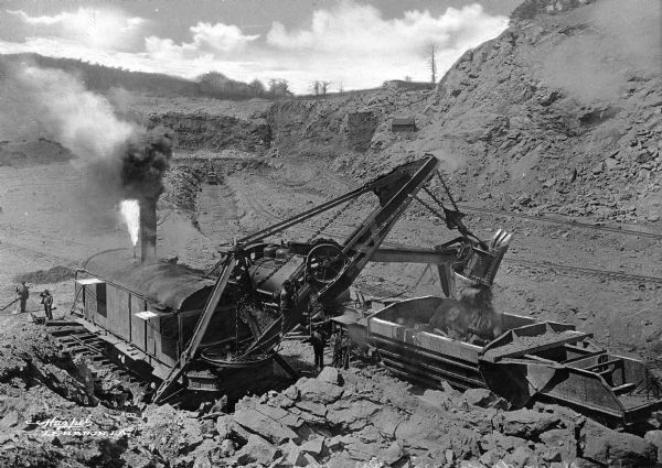Cornwall Ore Banks includes one of the greatest iron mines in the world and it has been mined for more than two centuries. A steam shovel is shown loading iron ore from the greatest iron ore deposit east of Lake Superior.