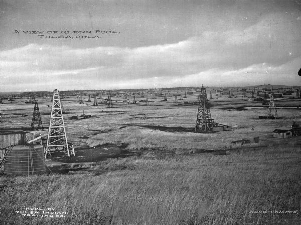 At Glenn Pool Oil Field, oil was first discovered on November 22, 1905 by Robert Galbreath and Frank Chesley. The Glenn Pool has produced 340 million barrels of oil since that day. Caption reads: "A View of Glenn Pool, Tulsa, Okla."