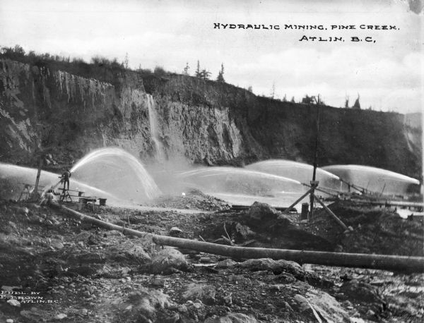 Hydraulic mining at Pine Creek, where gold was discovered in 1865, was the quickest way of mining gold deposits. Atlin was the site of the final great gold rush in Canadian history. Caption reads: "Hydraulic Mining, Pine Cree. Atlin, B.C."