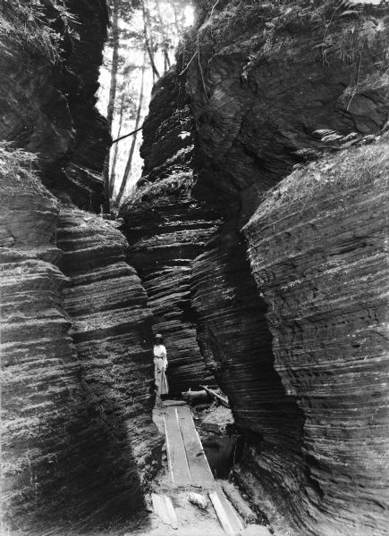 Woman at Cold Water Canyon View of a woman standing at Cold Water Canyon, a rock formation near the Wisconsin River.