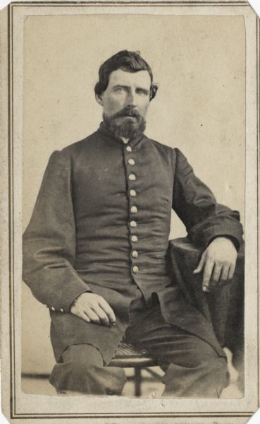 Seated carte-de-visite portrait of Captain Lewis Jones from Company E of the 4th Wisconsin Cavalry.