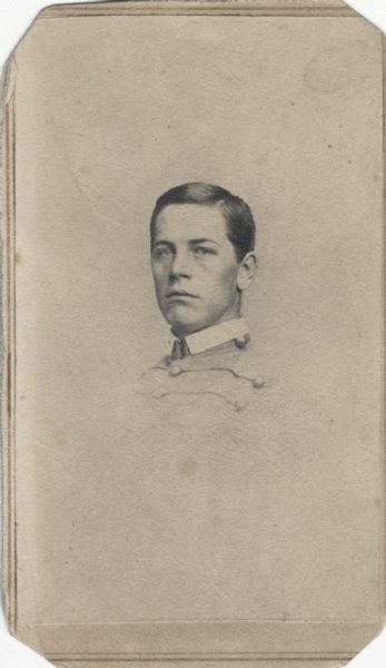 Vignetted carte-de-visite portrait of Corporal William H. Upham, Company H, 2nd Wisconsin Infantry, in a cadet uniform.